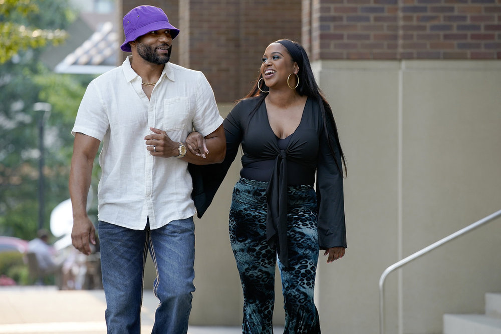 Chemar and Brandi Milton walking arm in arm 