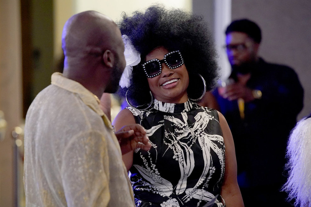 Dr. Heavenly in an afro wig 