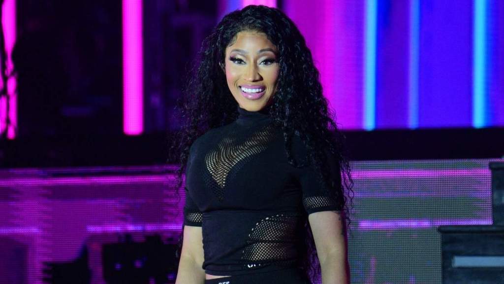 Nicki Minaj Lounges on Private Jet in Comfy Coat & Tights