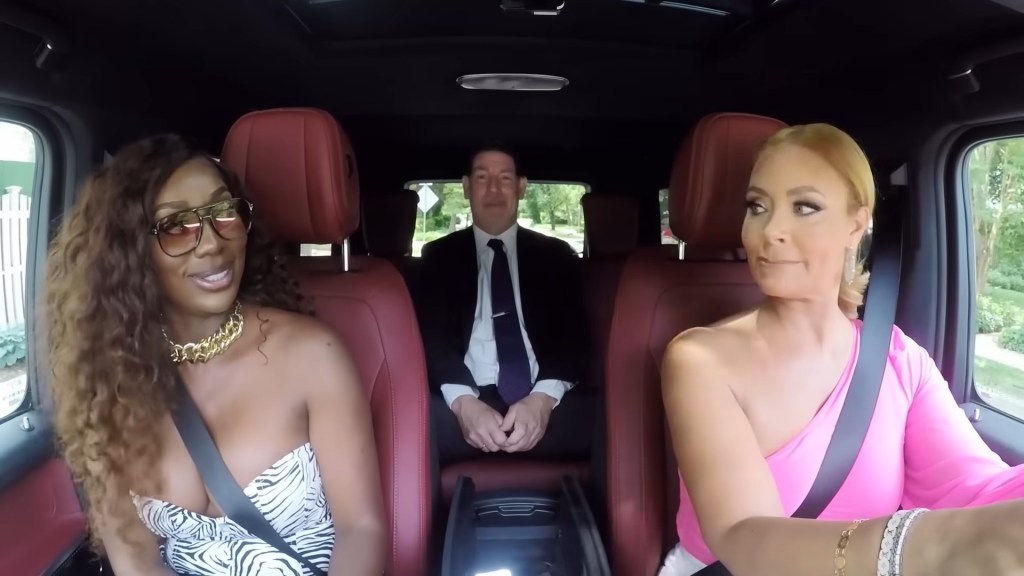 Wendy Osefo, Gizelle Bryant, and a car salesman riding in a G-Wagon