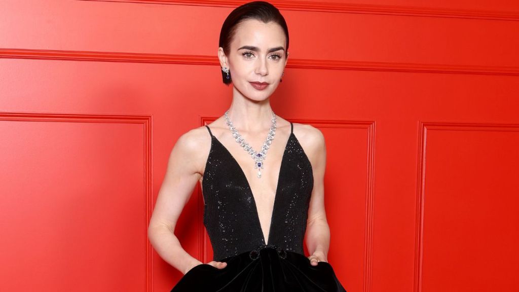 Lily Collins’ Black Gown Boldly Plunges Down to Her Midriff