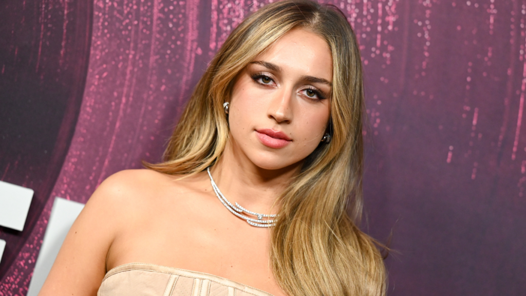 Tate McRae Dodges Fashion Mishap as Versace Top Shifts