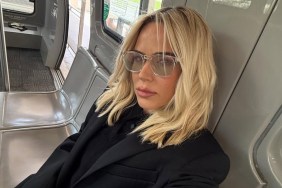 CJ Perry Wears Tiny PJ Shorts & Sips Coffee in Bed in Video