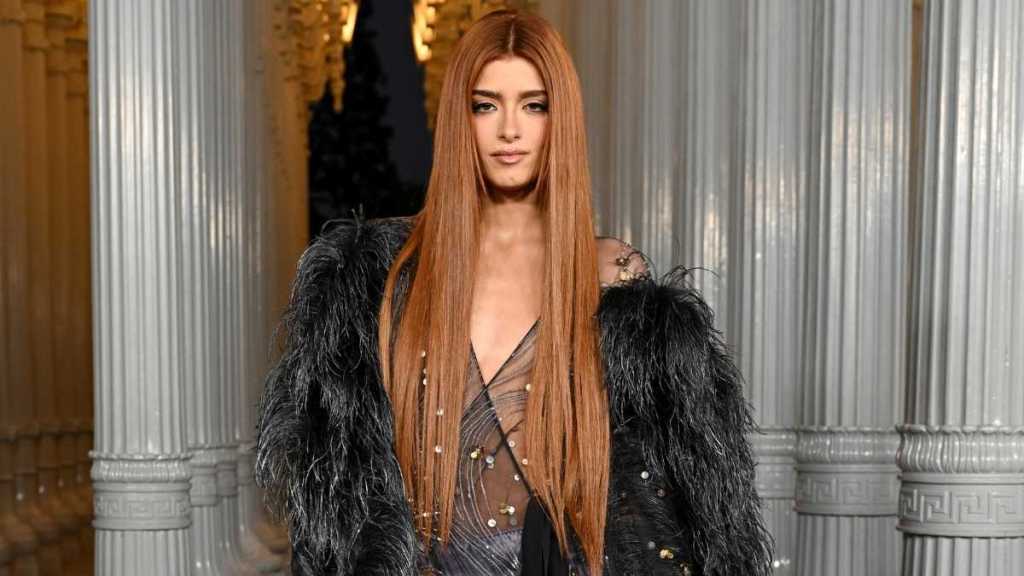 Dixie D’Amelio’s Fully Sheer Lacy Tights Add Flair to $2K Valentino Bag