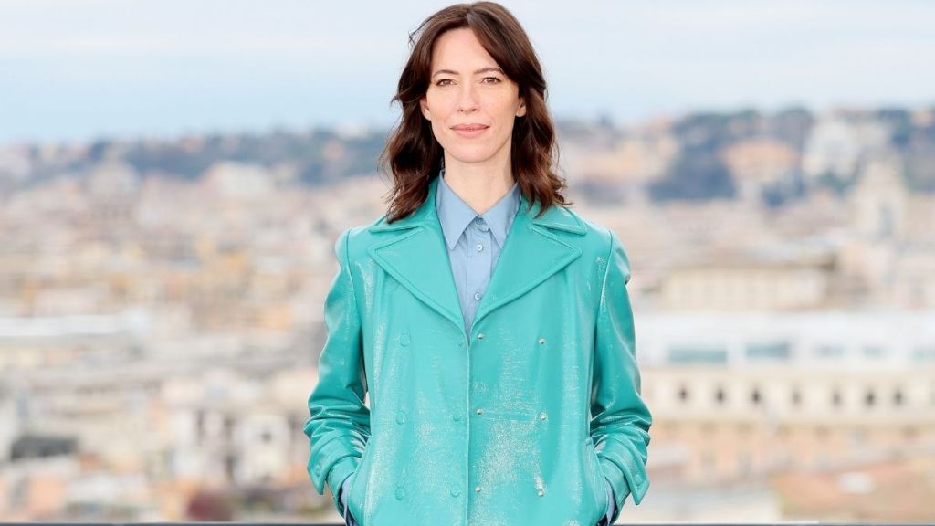 Rebecca Hall’s Fendi Micro Miniskirt Peeks Out From Under Her Coat