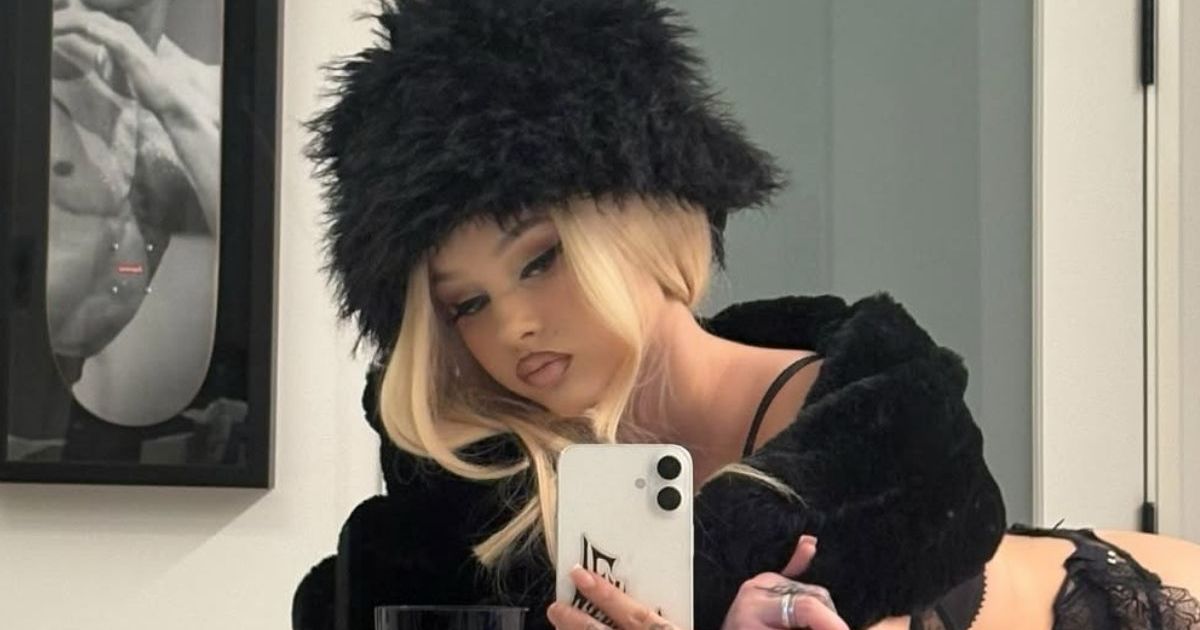 Alabama Barker Adds Lacy Stockings To Daring Leather Dress