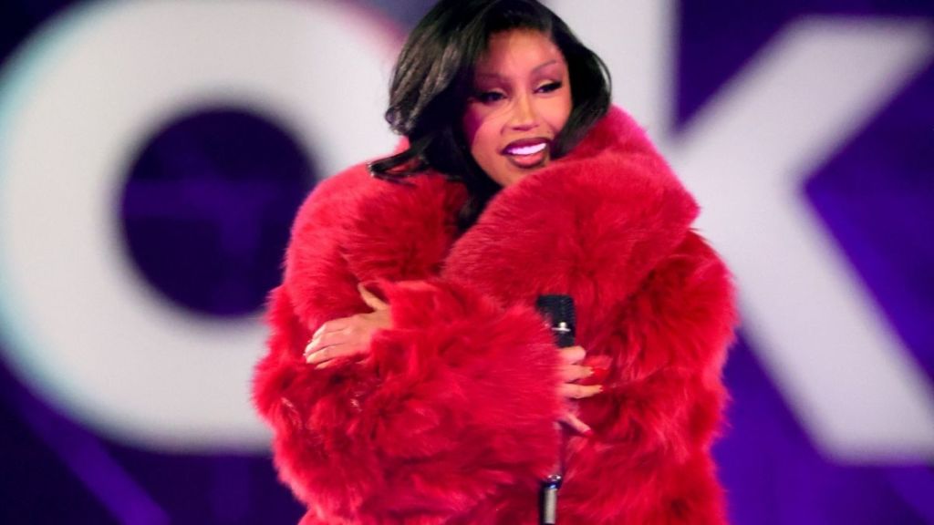 Cardi B Raps in a Bold Red Dress Amid Stefon Diggs Romance