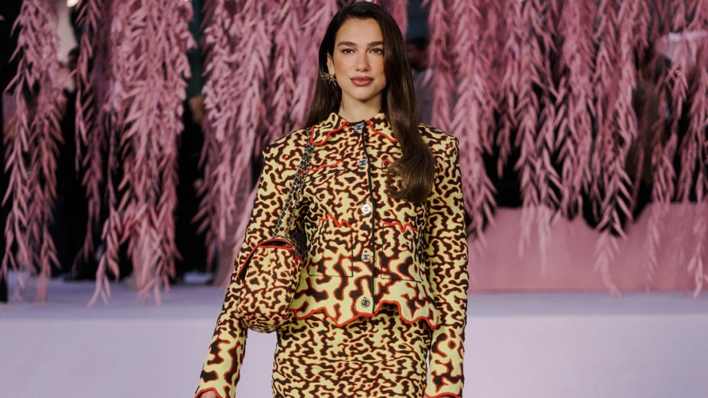 Dua Lipa Shines in Sleek Midi Skirt at Paris Fashion Week