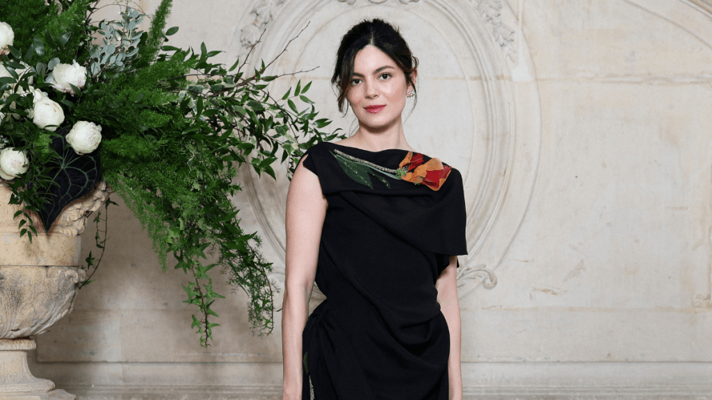 Monica Barbaro’s Draped Black Dior Dress Features a Hint of Color