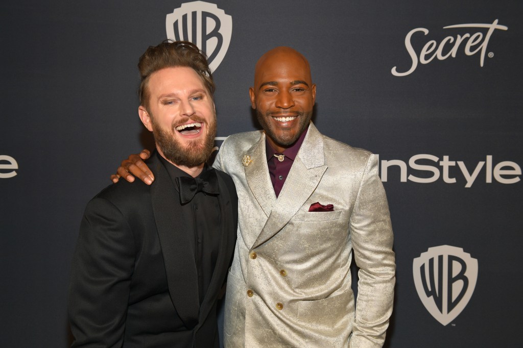 Karamo Brown with his arm around Bobby Berk