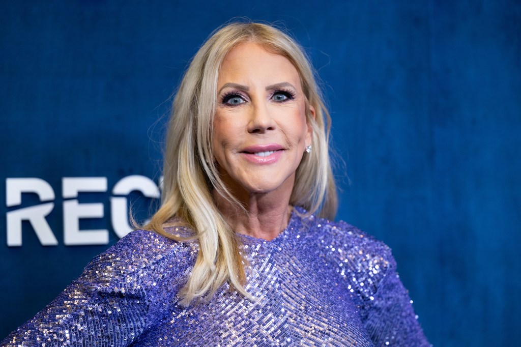 Vicki Gunvalson smiling and wearing a sparkling blue dress