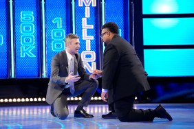 Chris Hardwick and a contestant kneeling on the ground on Season 6 of The Wall