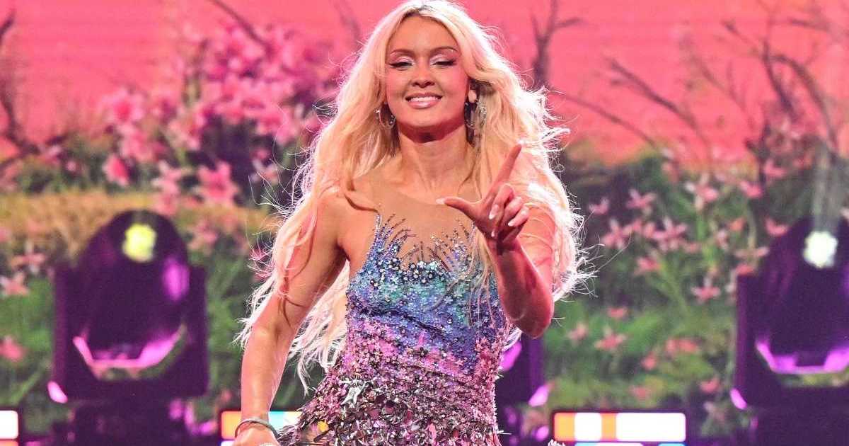 Zara Larsson Takes a Dolphin Ride in Micro Skirt & Bra Top