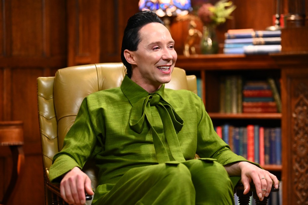 Johnny Weir in a green suit on The Traitors Season 4