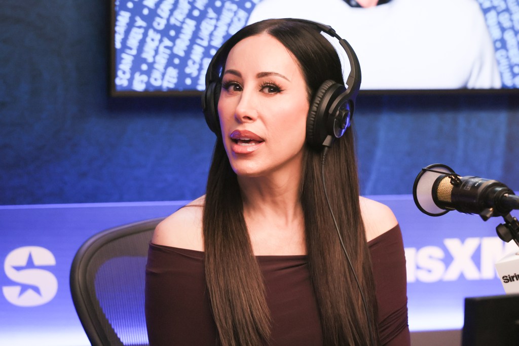 Angie Katsanevas wearing headphones during an interview at SiriusXM