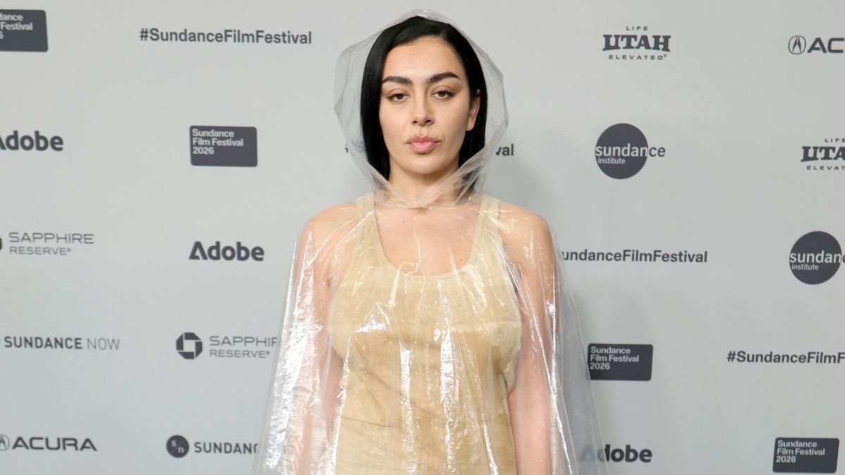 Charli XCX in black bikini and brown fur coat at Sundance 2026 for The Moment film premiere