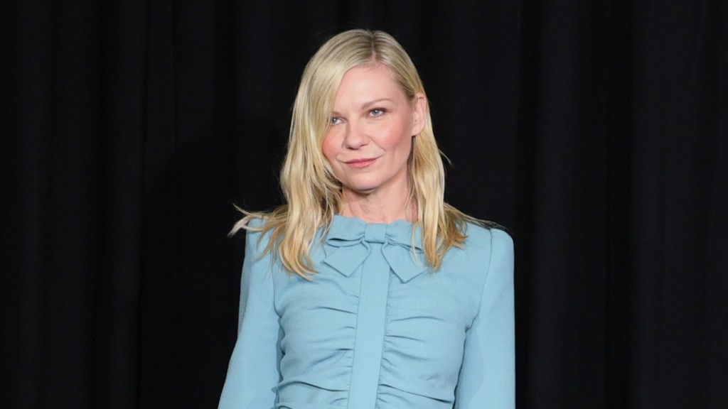 Kirsten Durst Turns Heads in Blue Mini Dress at Paris Fashion Week