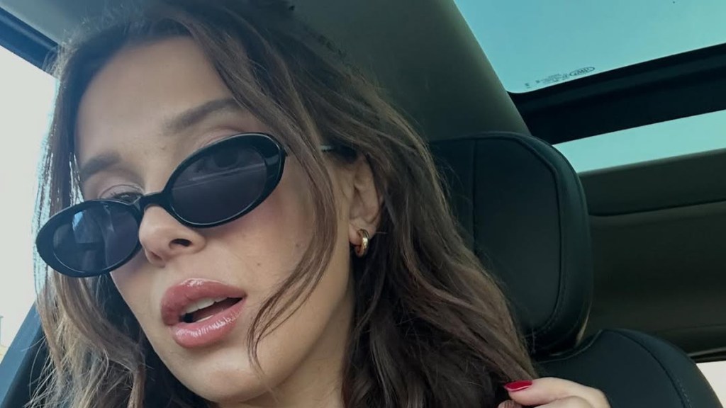 Millie Bobby Brown Lifts Her Tee & Flashes Bikini in Flirty Photo