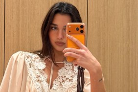Dua Lipa’s Lace Bra Peeks Out From Low-Cut Top