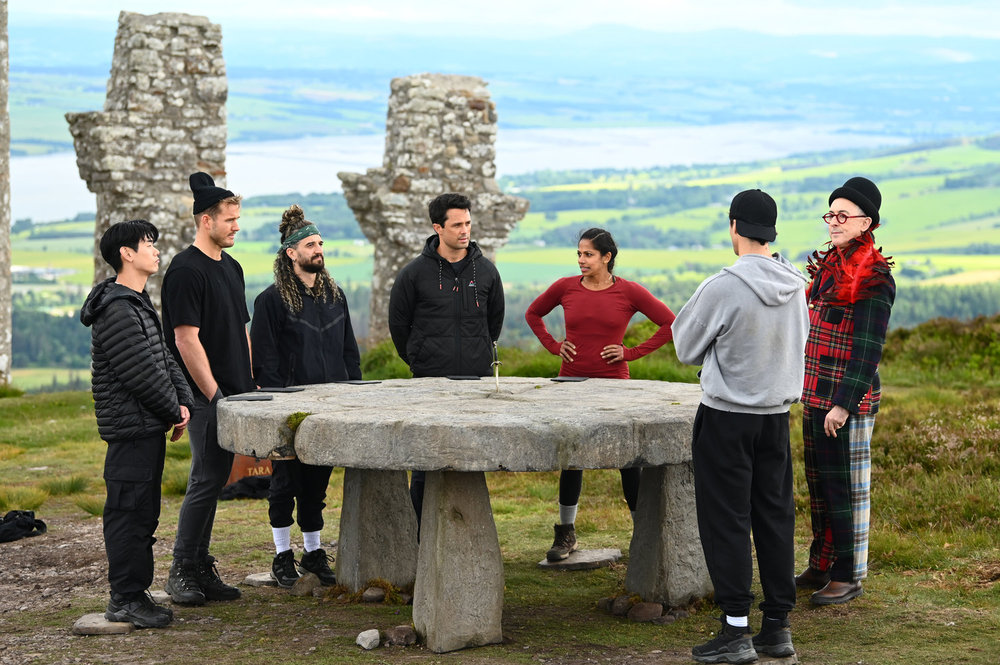 Eric Nam, Colton Underwood, Mark Ballas, Stephen Colletti, Natalie Anderson, Rob Rausch, Alan Cumming in The Traitors Season 4 Episode 7