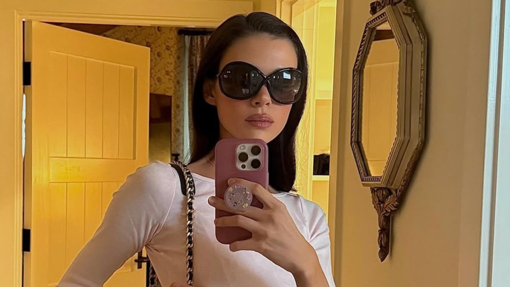 Nicola Peltz Beckham Pairs Striped Minidress With Chic Chanel Bag