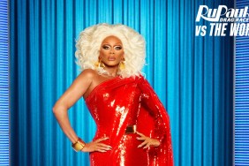 RuPaul posing in a red gown for RuPaul's Drag Race UK vs The World