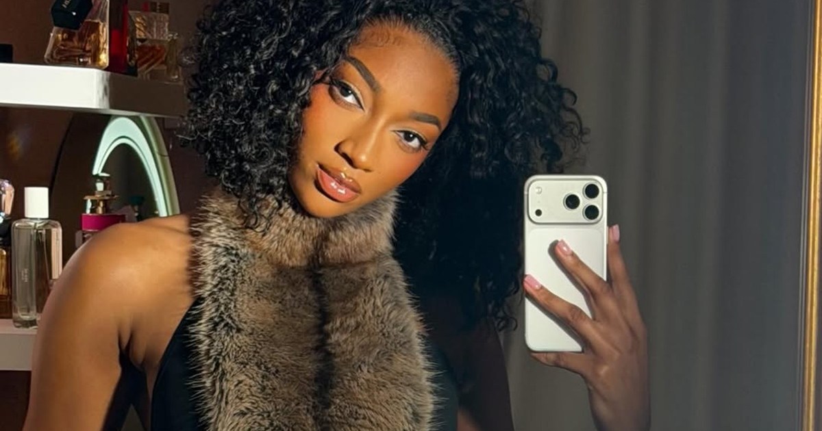 Angel Reese’s Catsuit Photo Shows Her Striking a Pose for Her Podcast