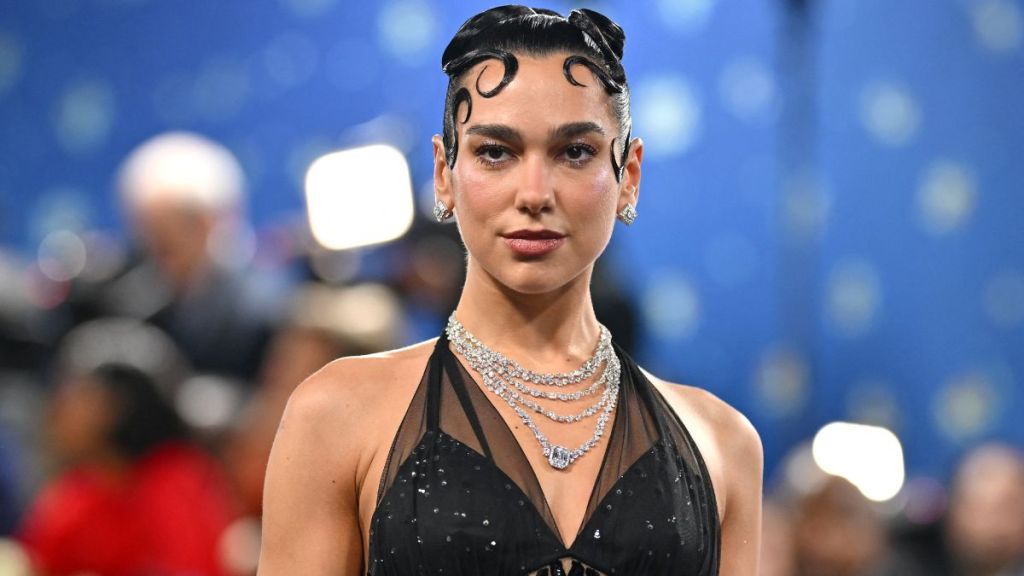 Dua Lipa Layers Bra Under Completely Sheer Shirt in YSL Beauty Ad