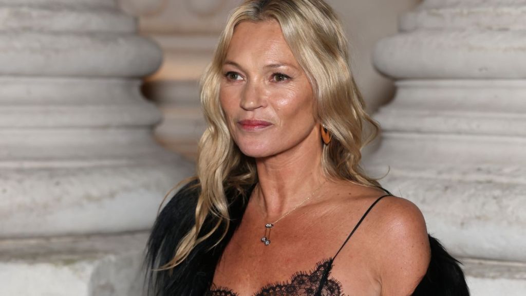 Kate Moss Wows in Lingerie-Coded Top & High Slit Skirt for Saint Laurent