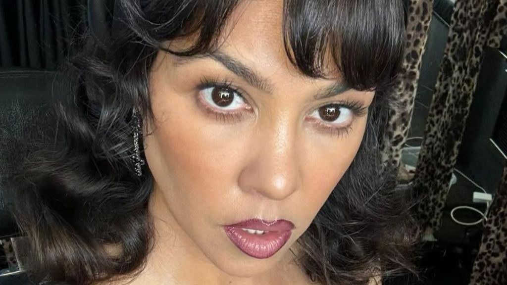 Kourtney Kardashian’s Strapless Swimsuit Photo Shows Her in the Pool