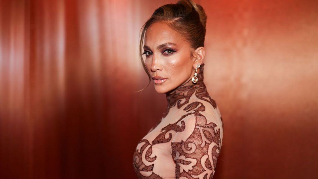 Jennifer Lopez’s Lacy Dress Is Sheer & Stunning as She Skips Grammys