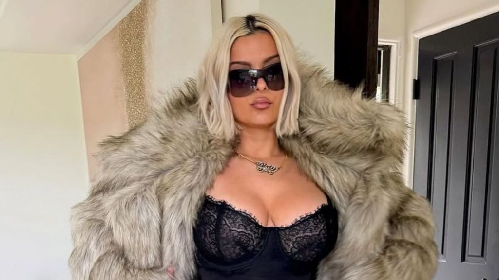 Bebe Rexha Makes Waves Courtside in a Lacy Top