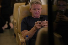 Gordon Ramsay on an airplane looking at his phone