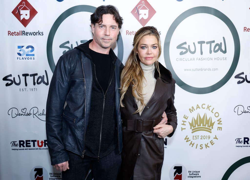 Aaron Phypers with his arm around Denise Richards