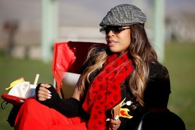 Mary Cosby sitting in a lawn chair in a red scarf