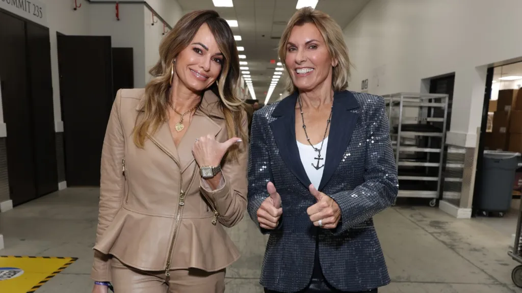 Captain Sandy Yawn giving a thumbs up, walking next to Leah Yawn