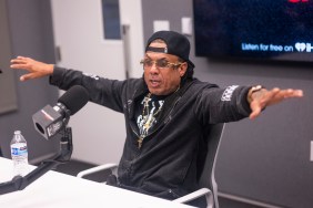 Benzino doing an interview at a radio station and holding his arms out