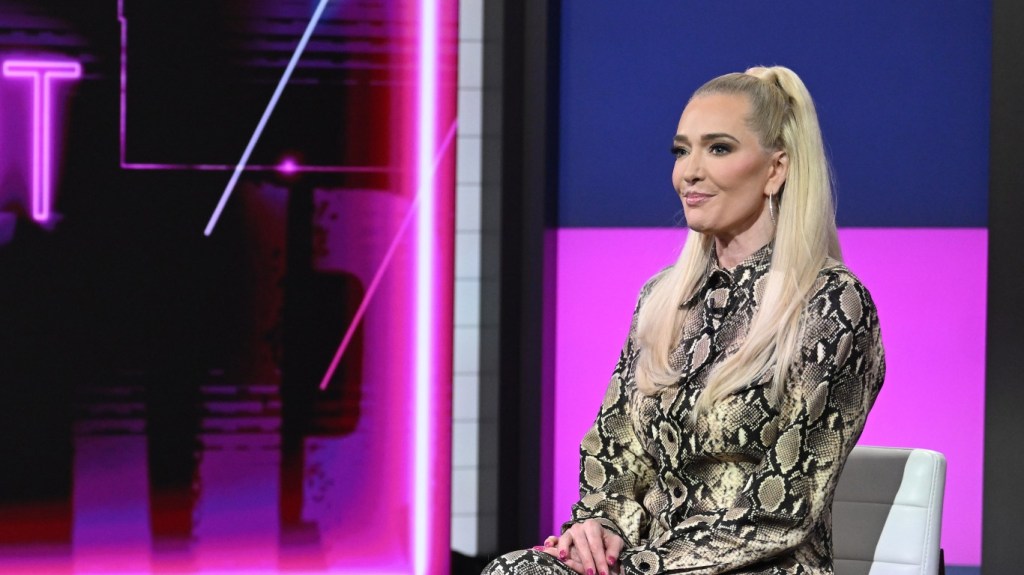 Erika Jayne wearing a snakeskin suit and making a blank expression on Good Day New York