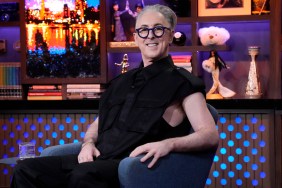 Alan Cumming in a black vest on Watch What Happens Live