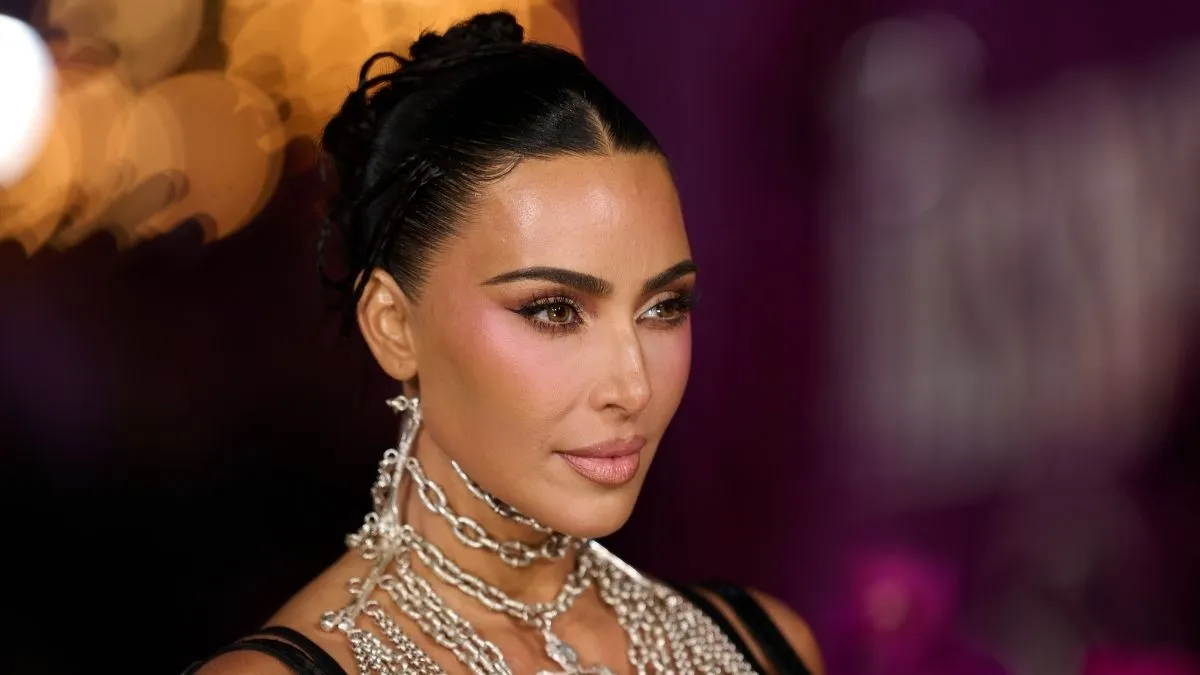 Kim Kardashian in a black SKIMS bikini for the 2026 spring campaign
