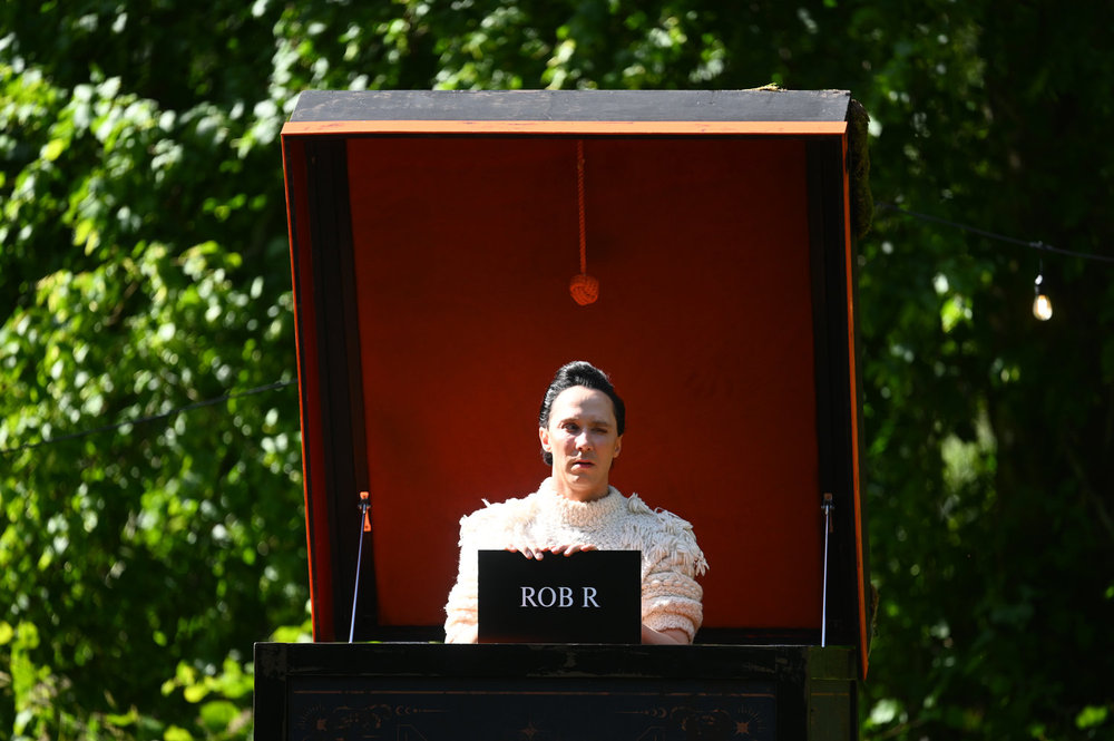 Johnny Weir popping out of a box on The Traitors Season 4