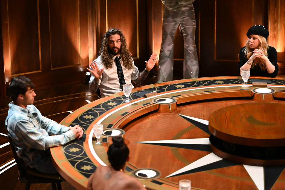 Mark Ballas throwing his hands up at the roundtable on The Traitors Season 4 