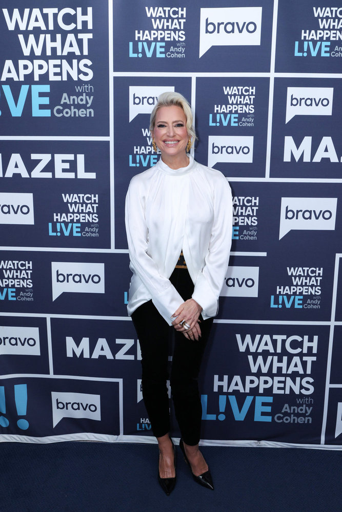 Dorinda Medley in a white blouse posing backstage at Watch What Happens Live