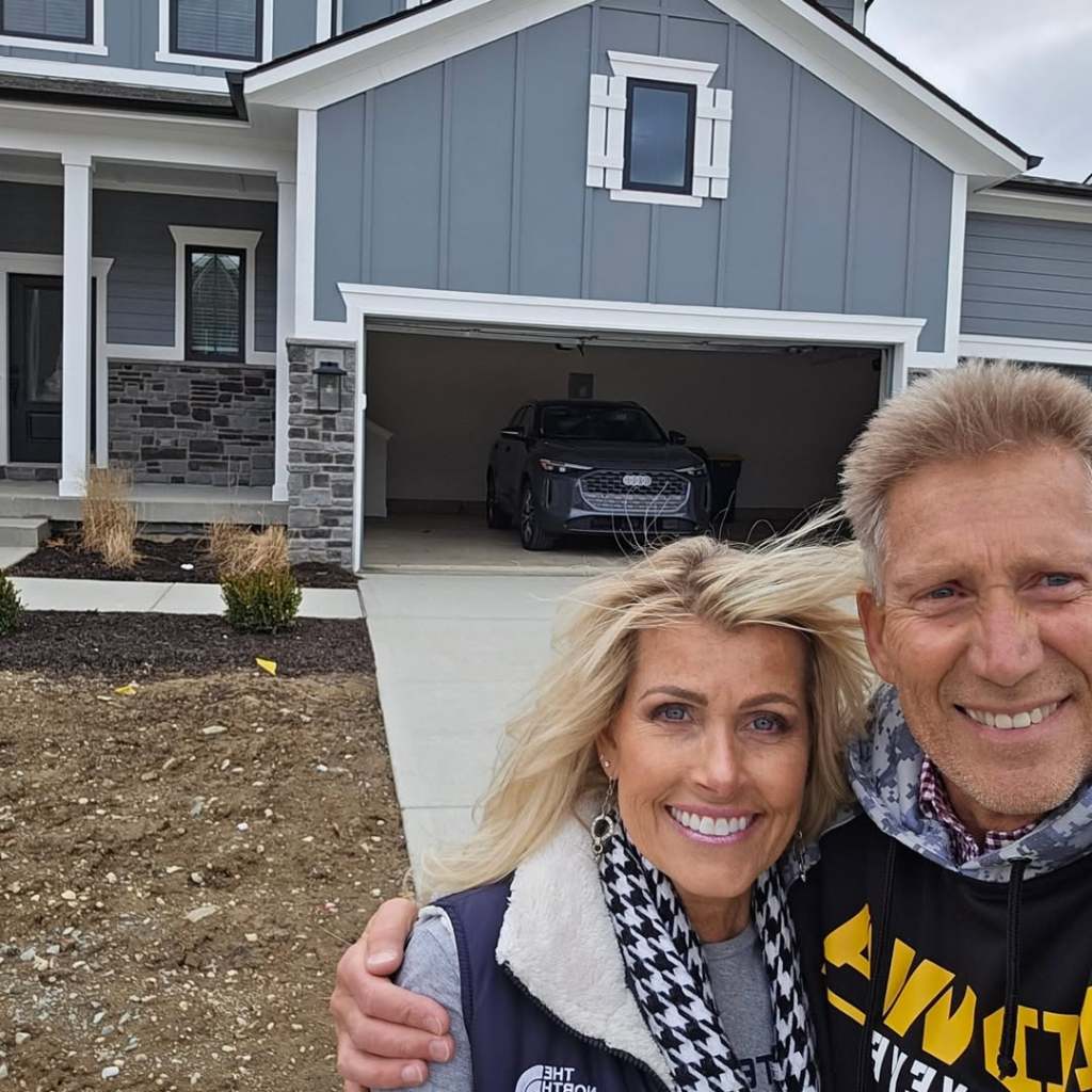 Lana Sutton and Gerry Turner posing in front of their new home