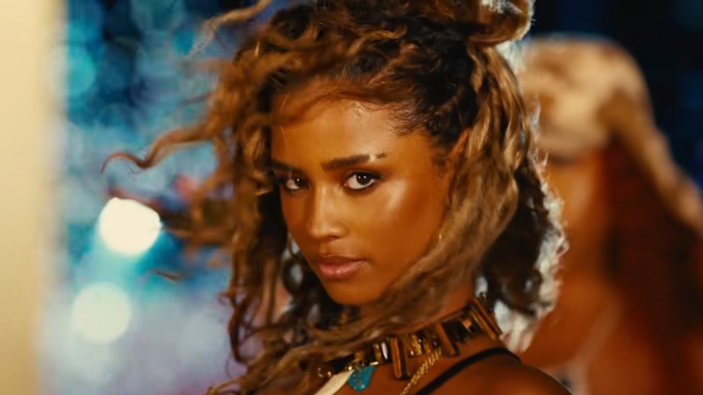 Tyla Commands Attention in Chic Lacy Top at NBA Showdown