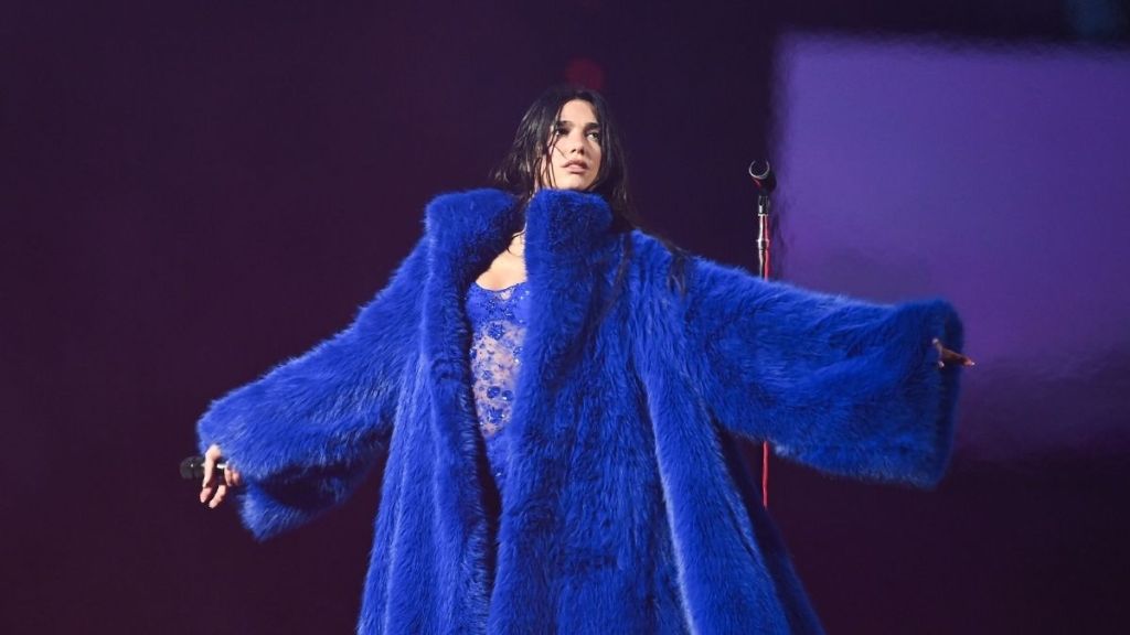 Dua Lipa Wraps Herself in Chic Fur Coat for Service95 Milestone
