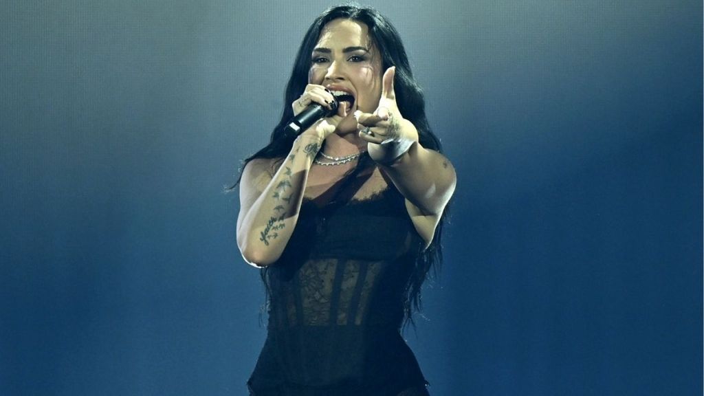 Demi Lovato Pops off in Fully Sheer Bodysuit & Fishnet Tights for Tour Reveal