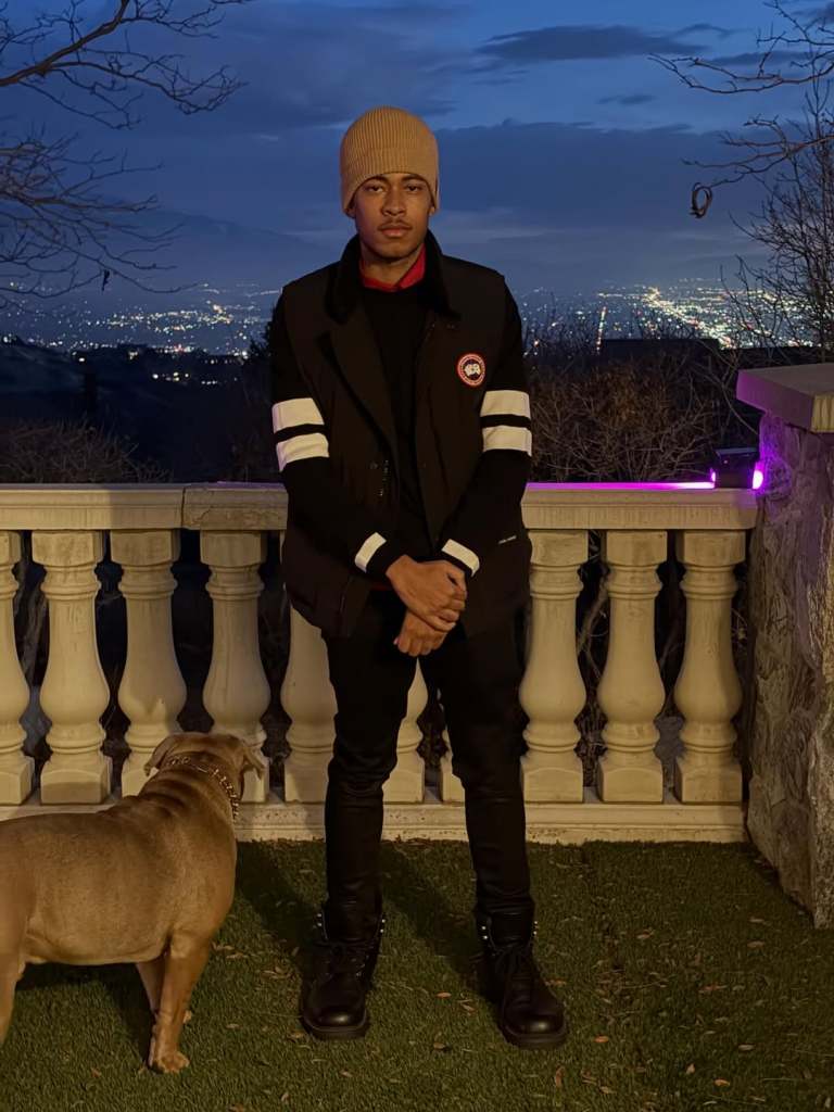 Robert Cosby Jr. posing with a dog