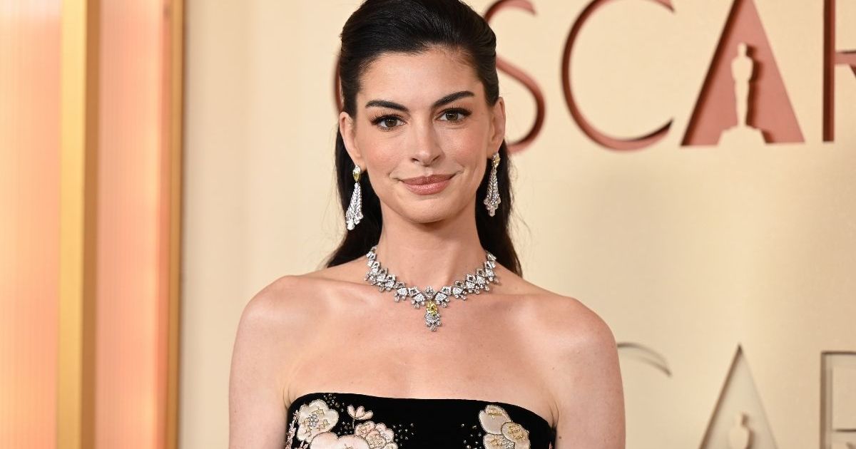 Anne Hathaway Takes the Mob Wife Route in Chic Michael Kors Coat