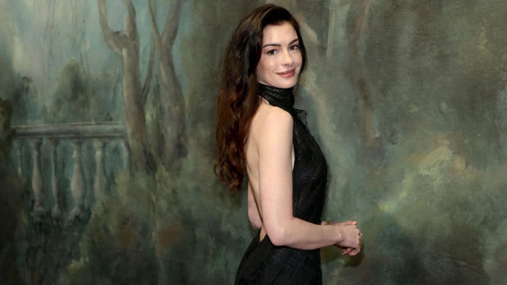 Anne Hathaway’s High Slit See-Through Dior Dress Hangs by Just 2 Strings